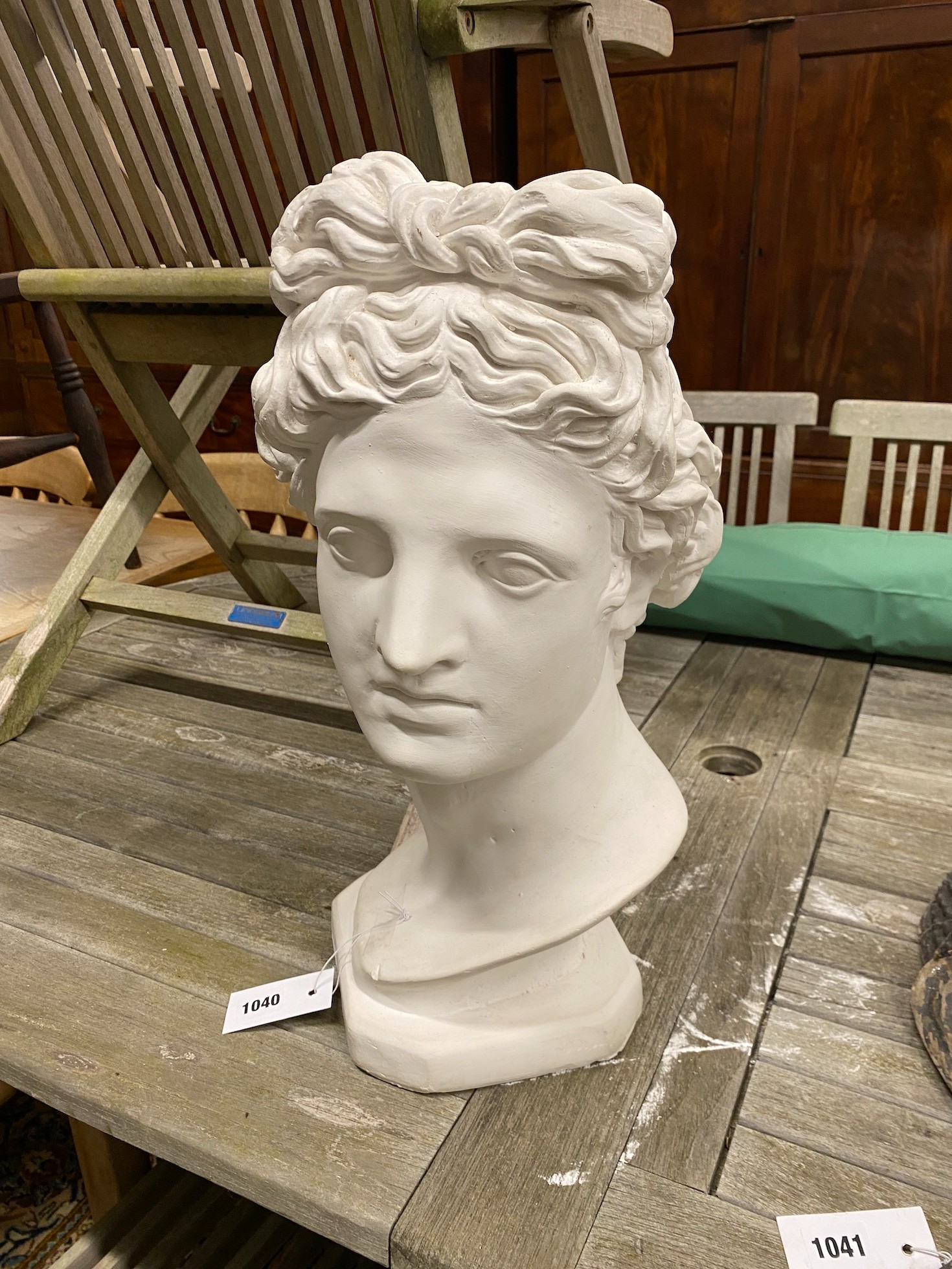 A plaster bust of Apollo, height 49cm